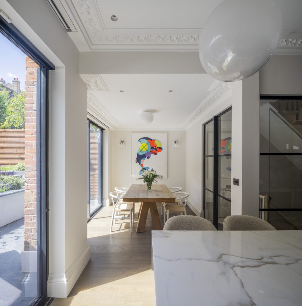 Dining area with glazed doors at Muswell Haven