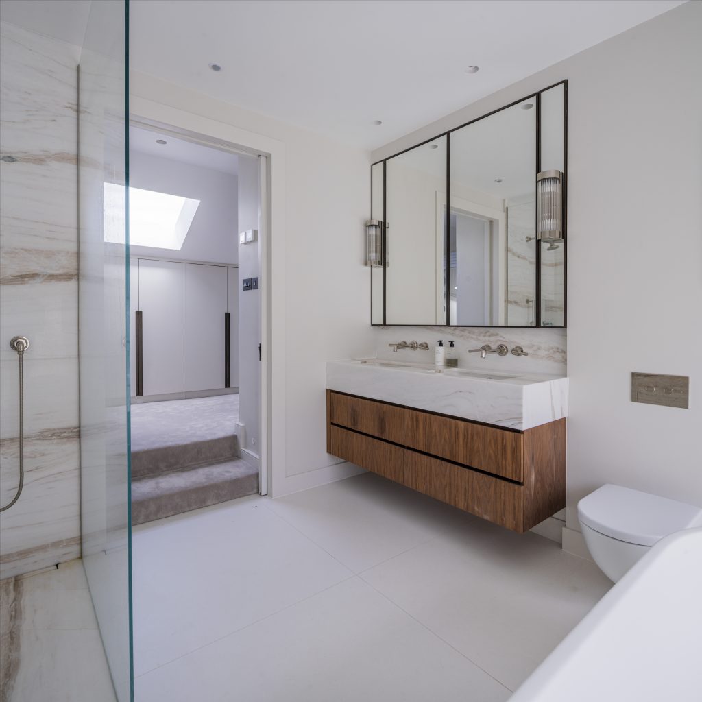Marble bathroom with rooflight at Muswell Haven