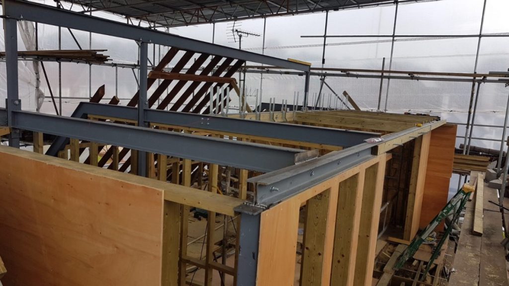 Structural steel frame during ground-floor works at the East Finchley family home