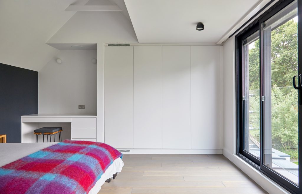 Fitted wardrobes and dressing area in the new East Finchley loft bedroom