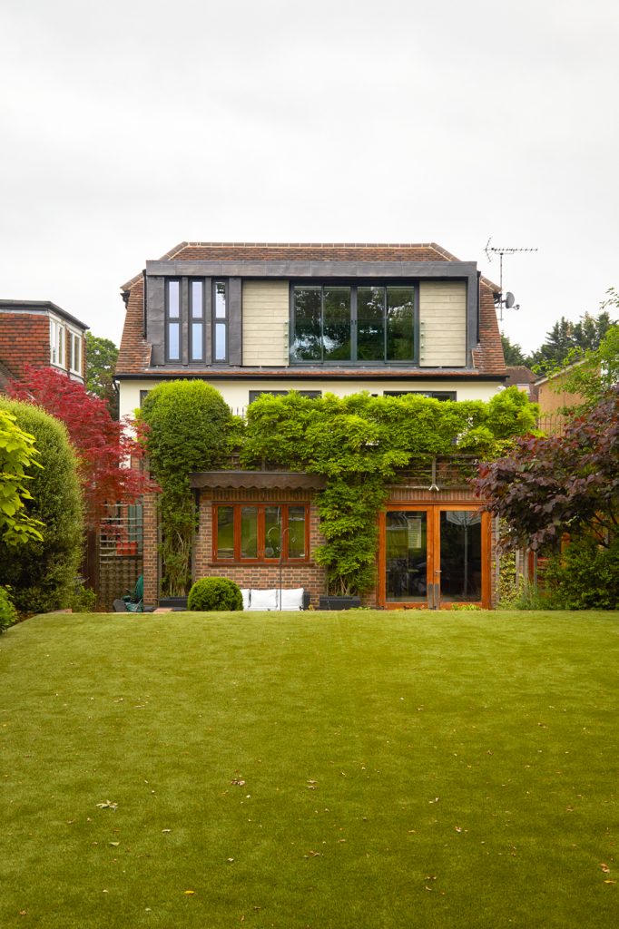 Completed East Finchley loft conversion and family home viewed from the rear garden