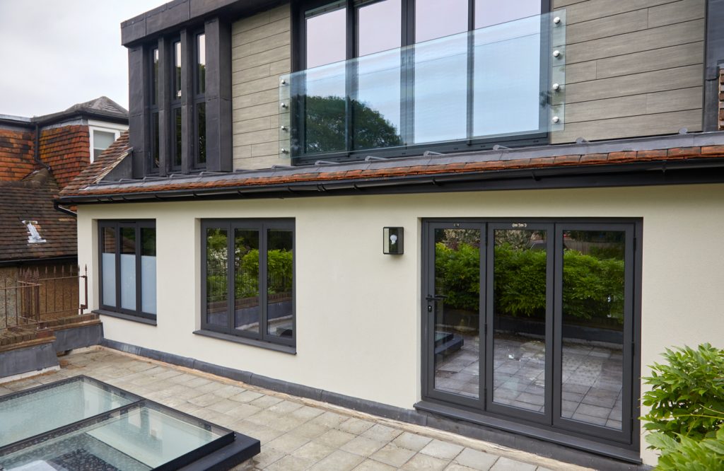 Completed rear dormer, glazed Juliet balustrade and ground-floor bifold doors on the East Finchley home